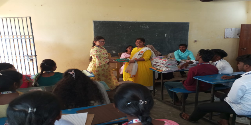 Alumni distributing books to students