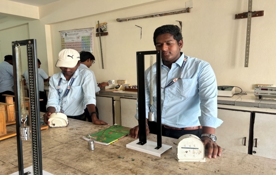 Students performing experiments in chemistry lab
